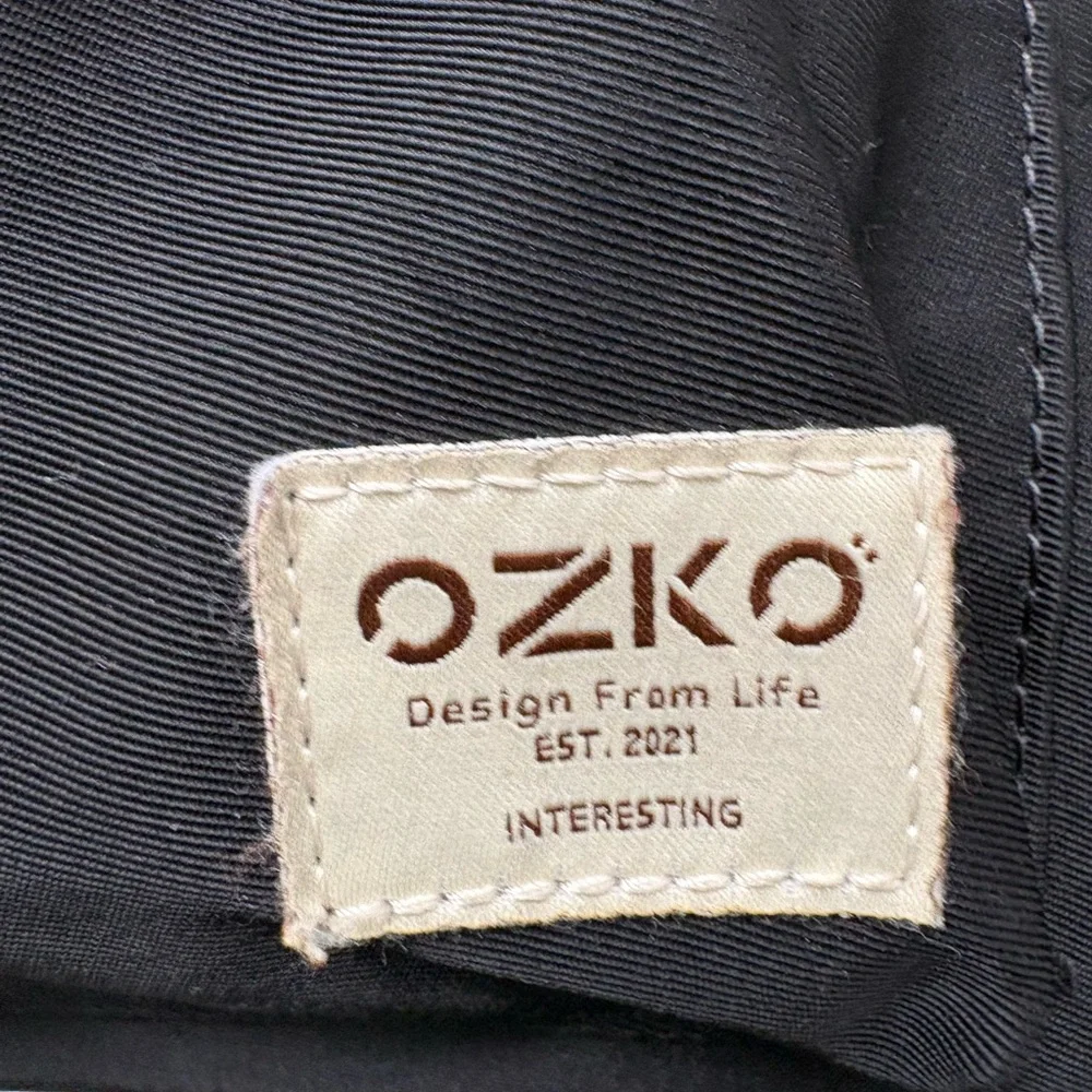Ozuko bag, used as both a backpack and a messenger or tote bag.